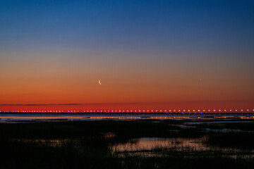 Sunset or sunrise with clouds . Red sunset and moon . beautiful sky . Prayer time . Generous Ramadan . Mubarak background .