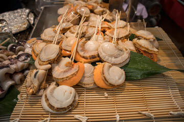 Big korean sea snails as street food in Jeju, South Korea.