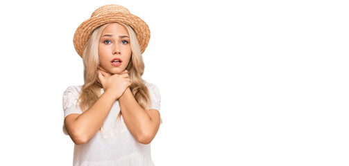 Young blonde girl wearing summer hat shouting and suffocate because painful strangle. health problem. asphyxiate and suicide concept.