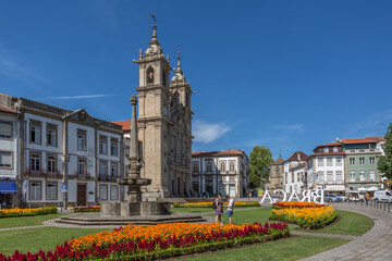 View at the iconic garden with a couple, on Braga downtown city and big piazza and Saint Marcos church, hotel Vila Gale as background