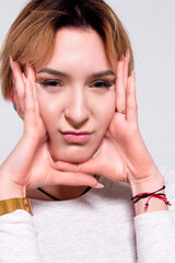 Naklejka premium portrait of a blonde girl on a white background