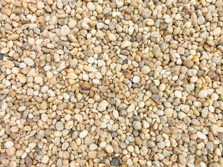 View of textures of various cobble stones, yellowish colors, used for roofing of buildings