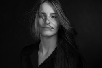 Black and white portrait of a young girl with long hair