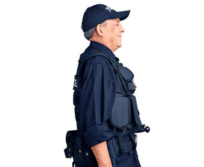 Senior handsome man wearing police uniform looking to side, relax profile pose with natural face...