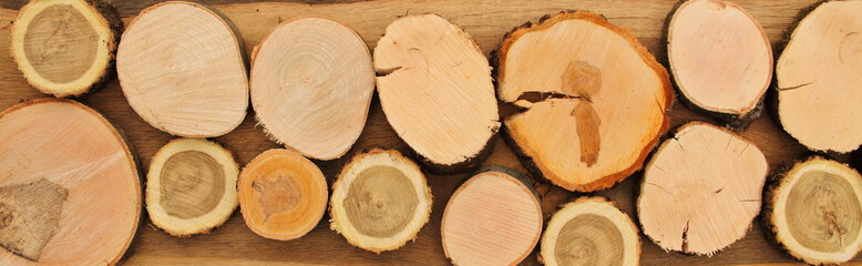 different round wooden disks as a background on a board