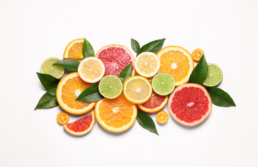 Fresh juicy citrus fruits with green leaves on white background, flat lay