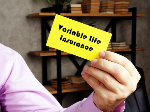 Business concept about Variable Life Insurance with phrase on the yelow business card.