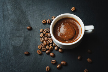 Obraz na płótnie Canvas Steaming espresso served in cup on dark