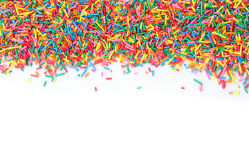 Colorful sprinkles on white background, top view. Confectionery decor