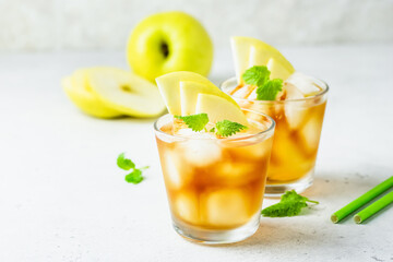 apple iced tea in glasses. Space for text.