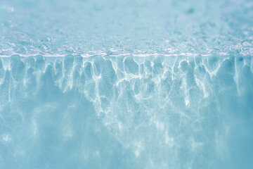 Stylish background with water ripple texture. Glass with effect the reflections of surface water