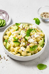 Crunchy vegetarian cucumber pasta salad. Space for text.