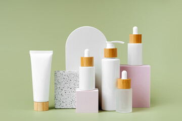 Pump bottle, cream tube, and dropper on square podiums pastel color background. Cosmetic container mockup. Background for branding and packaging presentation. Natural skincare beauty product concept.