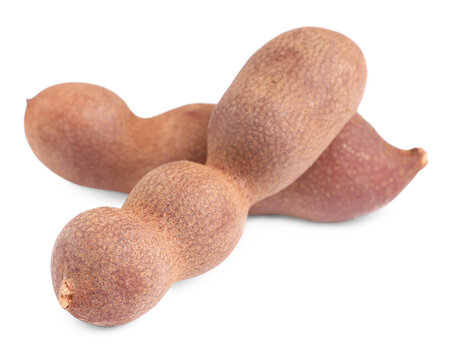 Delicious ripe tamarinds on white background. Exotic fruit