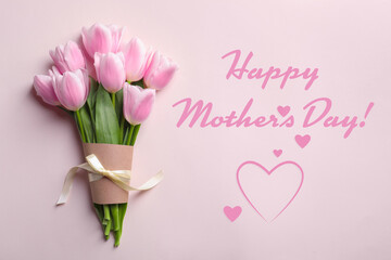 Happy Mother's Day. Bouquet of beautiful tulips on pink background, top view