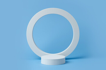 White podium to show cosmetic products with geometric forms on blue background. Background for...