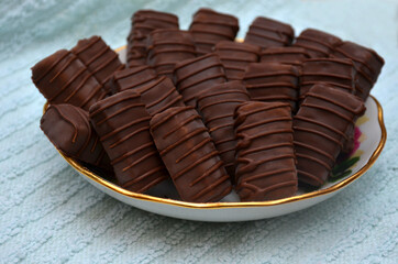 Sweets are on a plate. Blue background.