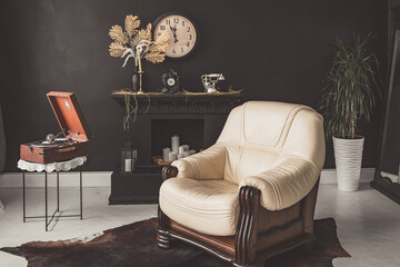 Retro vintage interior. Retro living room interior in dark black colors. Retro leather chair and fireplace