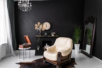 Retro vintage interior. Retro living room interior in dark black colors. Retro leather chair and fireplace