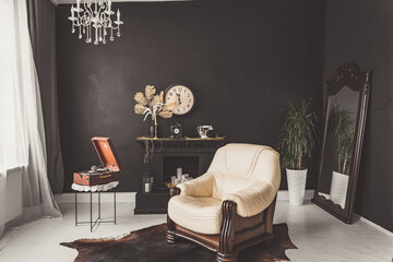 Retro vintage interior. Retro living room interior in dark black colors. Retro leather chair and...