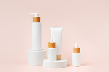 Pump bottle, cream tube, and dropper on pastel color background. Cosmetic container mock-ups. Background for branding and packaging presentation. Natural skincare beauty product concept.