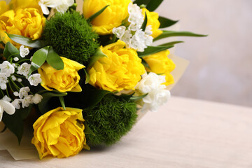 Beautiful bouquet with peony tulips on wooden table, closeup