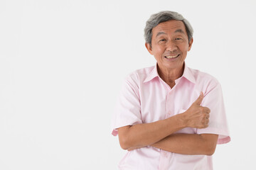 Portrait of a senior older Asian man good positive looking pose with happy and confident to camera rise hand for thumb up on white background