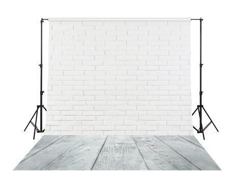 Photo background with white brick wall and wooden floor. Professional studio equipment