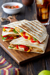Quesadilla with chicken, tomatoes, corn, cheese and chilli. Mexican food. Fast food.