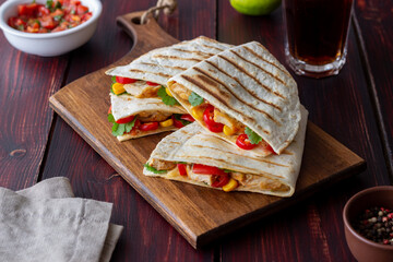 Quesadilla with chicken, tomatoes, corn, cheese and chilli. Mexican food. Fast food.