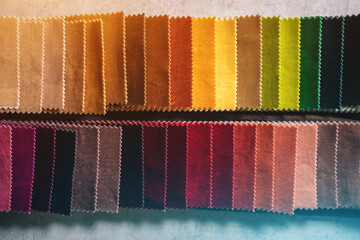 closeup of fabric colorful velvet samples palette at textile showroom