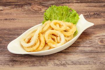 Roasted squid rings with salad