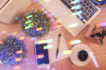 Double exposure of technology theme drawing over work table desktop. Top view. Global data analysis concept.