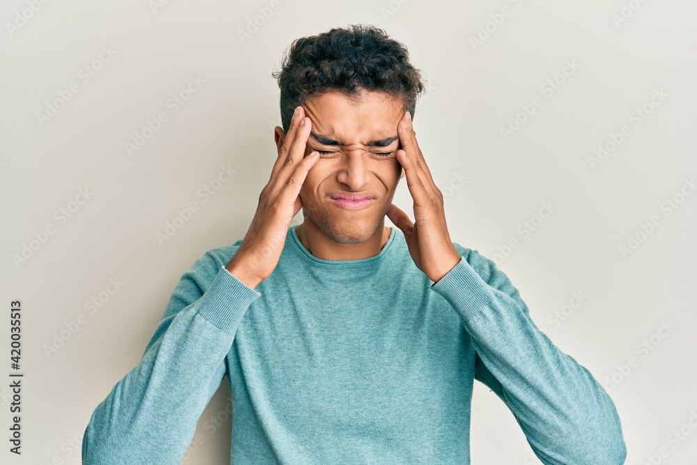 Sticker young handsome african american man wearing casual clothes with hand on head, headache because stres