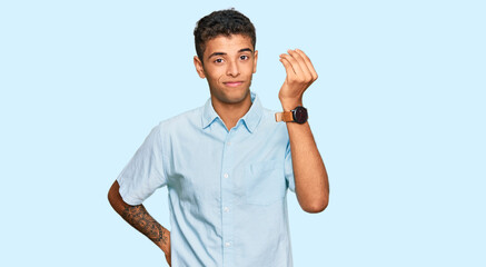 Young handsome african american man wearing casual clothes doing italian gesture with hand and fingers confident expression