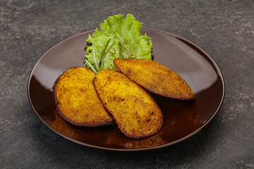 Baked potato with herbs and spices