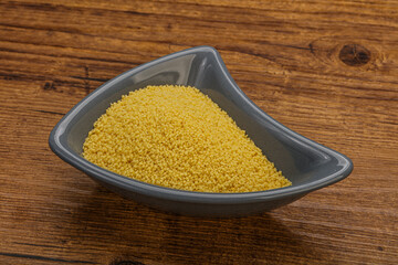 Raw cous cous heap in the bowl