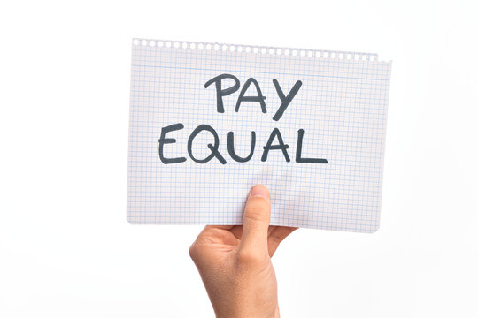 Cardboard banner protesting for equal payment for women and men over isolated white background