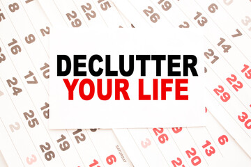 text DECLUTTER YOUR LIFE on a sheet from Notepad.a digital background. business concept . business and Finance.