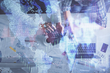 Obraz premium Double exposure of man and woman working together and financial graph hologram drawing. market analysis concept. Computer background. Top View.