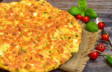  Homemade  italian  frittata  omelette  cheese pie  with potatoes and organic bio eggs,ham,cheese and   cherry tomatoes and fresh  ruccola. 