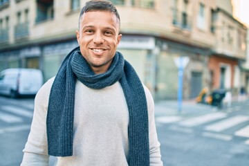 Young caucasian man smiling happy walking at the city.