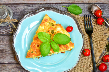  Homemade  italian  frittata  omelette  cheese pie  with potatoes and organic bio eggs,ham,cheese and   cherry tomatoes and fresh  ruccola. 