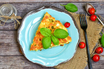  Homemade  italian  frittata  omelette  cheese pie  with potatoes and organic bio eggs,ham,cheese and   cherry tomatoes and fresh  ruccola. 