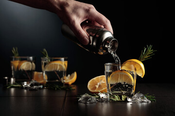 Cocktail Gin-tonic with lemon and rosemary.