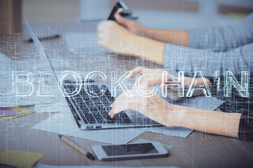 Double exposure of woman hands typing on computer and crypto market theme hologram drawing. Blockchain concept.