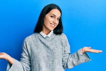 Young hispanic woman wearing casual clothes smiling showing both hands open palms, presenting and advertising comparison and balance