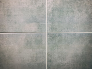 Fototapeta premium Tile in mint color with texture and even seams, background texture of tiles