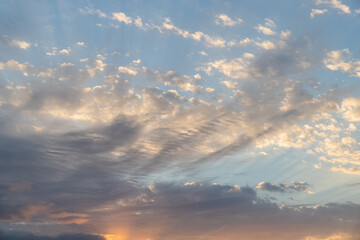 Naklejka na ściany i meble Sunrise sky with a bit of clouds.