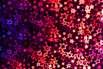 Multicolored stars shimmer in different shades, starry bokeh, background